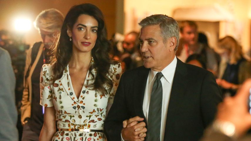 Amal und George Clooney bei einem UN-Meeting