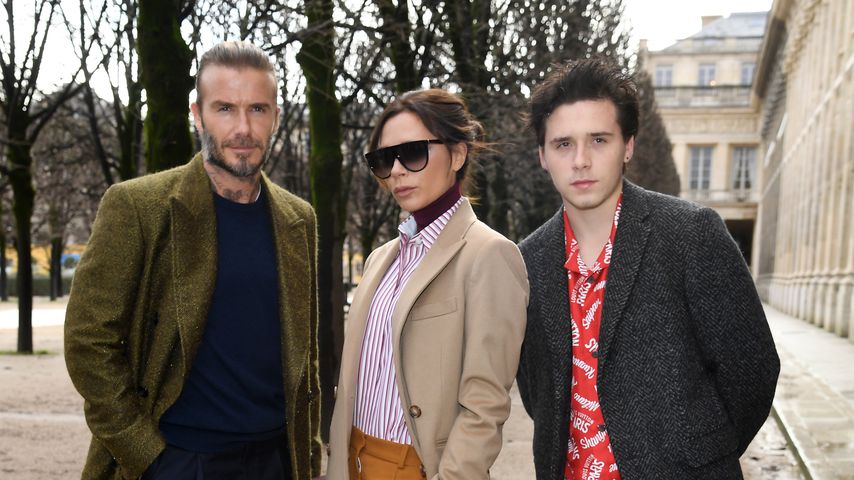 David, Victoria und Brooklyn Beckham auf der Paris Fashion Week