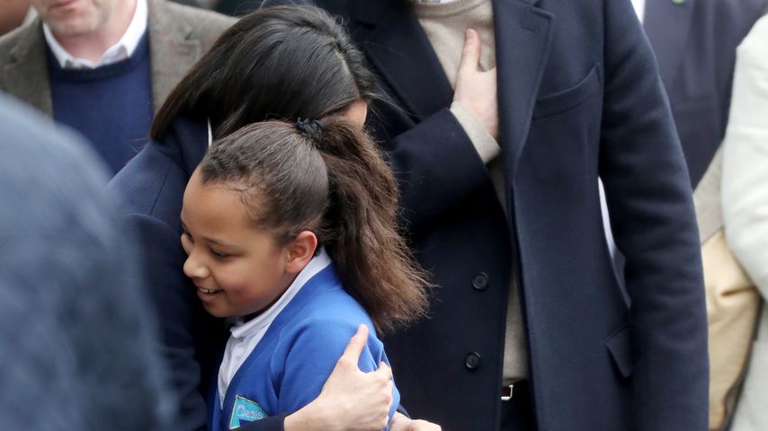 Prinz Harry, Meghan Markle und ein Mädchen