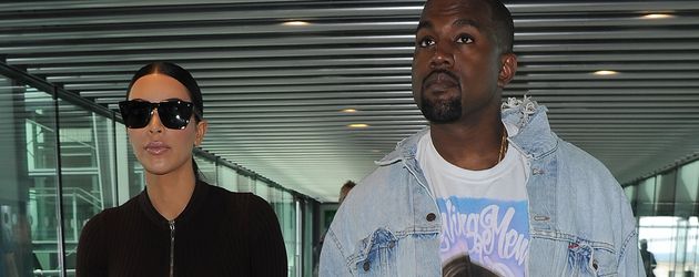 Kim Kardashian und Kanye West am Heathrow Airport Kim Kardashian und Kanye West am Heathrow Airport